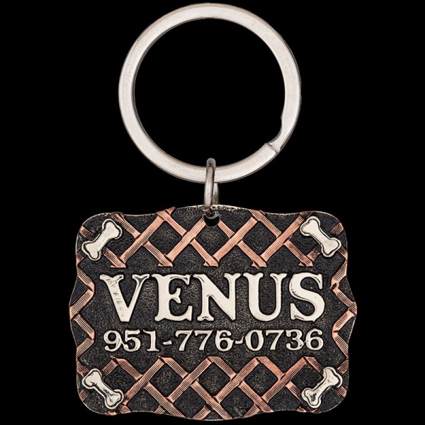 Meet the Venus Custom Dog Tag! Featuring a German Silver base, adorned with dog bones and lettering, accented by cross slats of copper. Order now!